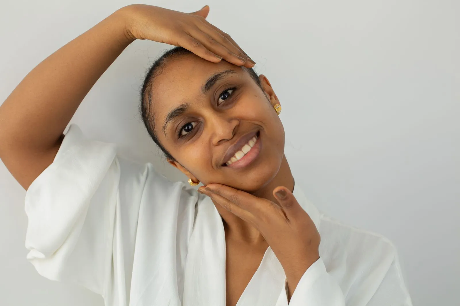 Woman with healthy, glowing skin after dermatologist-guided care in Baner, Pune